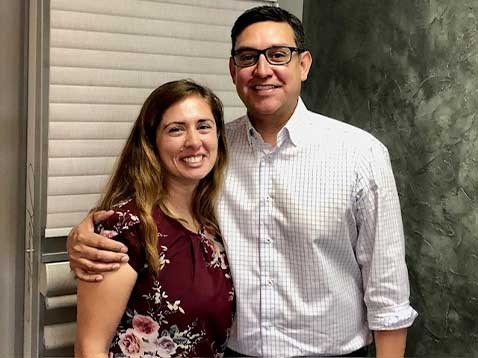 A couple posing for a photo together