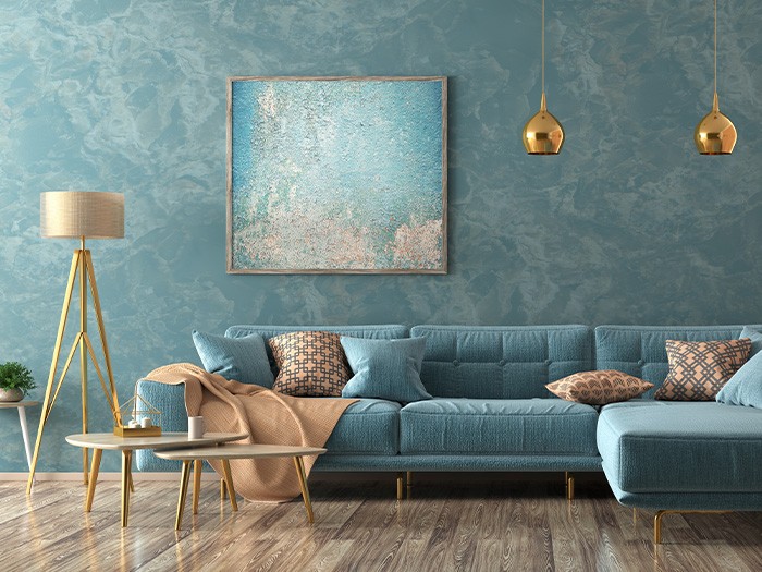 Teal living room with couch and floor lamp